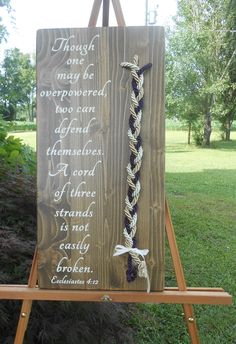 "A narrower sign with the full verse and larger cord. A beautiful alternative to the normal unity candle or sand ceremony. The ceremony shows how God is included in the union and the three of them can endure all things. The Cord of Three Strands symbolizes the joining of one man and one woman by God into a marriage relationship. Marriage takes three; you, your soon to be spouse, and God. By keeping Him at the center of your marriage, His love will continue to bind you together as one throughout Unity Symbol, Wedding Unity Ceremony, Wedding Ceremony Unity, Cord Of Three Strands, Rocky Point, Unity Ceremony, Wedding Unity, Wood Wedding Signs, Sand Ceremony