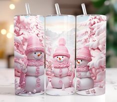 three frosty snowmen with pink hats and scarfs in front of a snowy scene