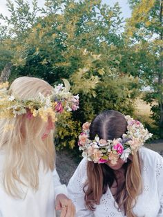 two girls with flower crowns on their heads