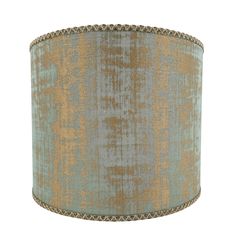 a lampshade with a blue and gold pattern on the fabric, isolated against a white background