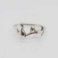 Sterling Silver Cats Ring ....Marked 925...Total of weights 1.3grams...Size 7...Measure of Face 8.2MM...It's in very good condition. Adjustable Sterling Silver Cat Design Rings, Silver Ring With Cat Design For Anniversary, Silver Promise Ring With Cat Design, Silver Anniversary Ring With Cat Design, Silver Cat Design Promise Ring, Anniversary Rings With Cat Design, Anniversary Cat Design Rings, Sterling Silver Cat Design Rings For Anniversary, Anniversary Sterling Silver Rings With Cat Design