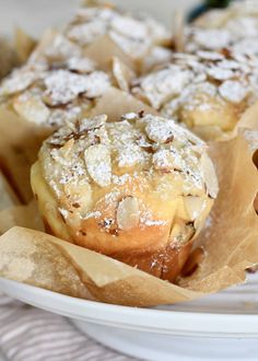 some muffins sitting on top of a white plate