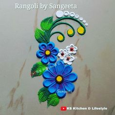 rangoli by sanggeetaa with blue flowers and green leaves