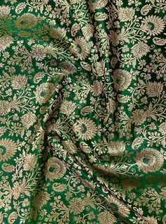 green and gold brocaded fabric