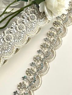 A beautifully crafted Pearl and Zircon trim with detailed thread work. Add this to your basic ethnic attire or attach it to your summer ball dress and turn it into a luxurious blend of art.  We are constantly adding new items and you will be sure to find our complete inventory with 1000's of designs at www.lacetrimssindia.com PLEASE NOTE : ALL ORDERS ARE SHIPPED FROM THE INDIA RETURN POLICY *All broken case can be re-sent or refund if the condition is proven by photo . *Exchange item or refund c Festive Embroidered Bridal Belt, Elegant White Embroidered Bridal Belt, Traditional Embellished Trims For Wedding, Elegant Embroidered Wedding Trims, Summer Ball Dress, Summer Ball Dresses, Lace Lehenga, Wedding Gown Lace, Summer Ball