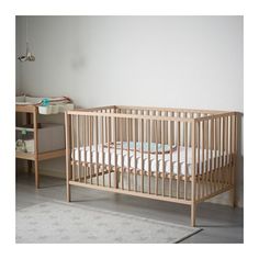 a baby crib in the corner of a room