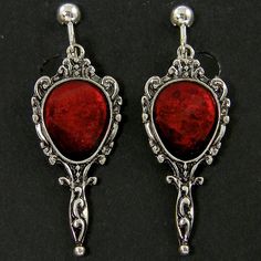 Dark blood red and antique silver clip on earrings feature an ornate mirror shape with red resin inlay. Style brings to mind vampire movies or old fairy tales. Earrings are 1 3/4 inches (45mm) long with screw backs and comfort cushions. See all photos for size reference. Matching necklace - https://www.etsy.com/listing/1069303835/dark-blood-red-antique-silver-necklace?ref=listing_published_alert Thank you for stopping by! Find more clip on styles here - https://www.etsy.com/shop/CharleneSevier?r Vampire Fairy, Jewelry Vampire, Resin Inlay, Antique Silver Necklace, Vampire Movies, Menu Sign, Gothic Vampire, Red Jewel, Ornate Mirror