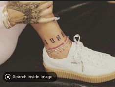 a woman's foot with a tattoo on her left ankle and the word rap written on it