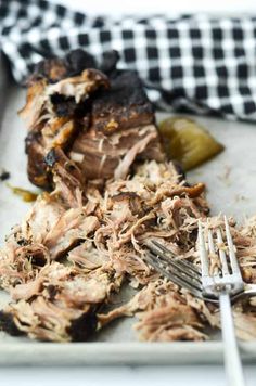 pulled pork on a plate with a fork