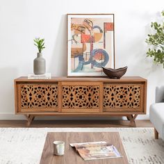 a living room scene with focus on the sideboard and coffee table in the foreground