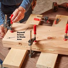 a person working with woodworking tools on a table