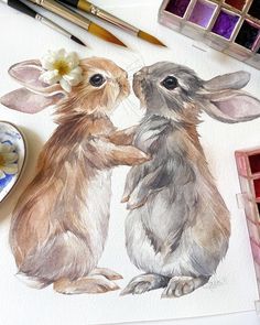 watercolor painting of two rabbits holding hands