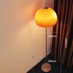 a floor lamp with measurements for the base