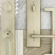 an assortment of door handles and knobs on marble