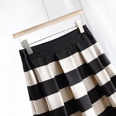 Discover Sophistication and Style Step into the season with confidence and grace with our Elegant Striped Mid-Calf Pleated Skirt. Perfectly tailored for the discerning woman who dresses to impress, this skirt combines classic stripes with a modern silhouette to elevate your wardrobe essentials. Crafted from high-quality polyester and designed with a blend of style and comfort, it's your ideal companion for both office and leisure. Product Features Material: Premium polyester for durability and easy care. Style: Office Lady, perfect for professional environments or sophisticated social settings. Elasticity: Slight stretch to accommodate your body shape comfortably. Season: Ideal for Spring/Summer, designed to keep you cool and stylish. Fabric Type: Blended fabric that offers breathability a Cardigan Sweater Vest, Crop Top Shirts, Style Office, Office Lady, Ladies Tops Fashion, Office Ladies, Fashion Tops, Empire Waist, Skirt Length