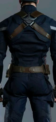 the back view of a man in a captain america suit with his hands on his hips