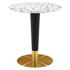 a white and black table with gold base on a white background, it is topped with small speckles