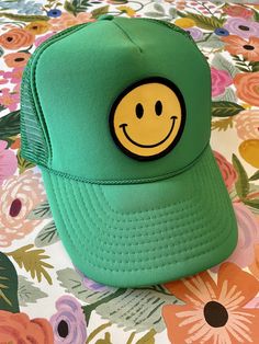 Our Smiley Face Trucker Hat is sure to bring a smile to everyone you pass by. Adjustable--one size fits most, comfortable, and breathable. Colors marked sold out are being restocked as quickly as possible. Keep smiling! Colors in order in 2nd photo: black, fuschia, neon pink, light pink, neon green, green, sand, blue, turquoise, light blue, white :) Novelty Green Adjustable Hat, Adjustable Green Novelty Hat, Green Brimmed Baseball Cap, Green Flat Brim Hat, One Size Fits Most, Cute Flat Brim Hat One Size, Playful Green Snapback Baseball Cap, Fun Green Baseball Cap With Curved Brim, Playful Green Baseball Cap One Size, Cute Brimmed Trucker Hat, One Size Fits Most