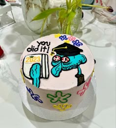 a decorated cake sitting on top of a table