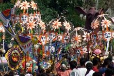 a group of people standing next to each other in front of an elephant head display