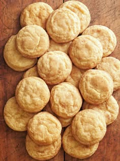 a pile of cookies sitting on top of a wooden table