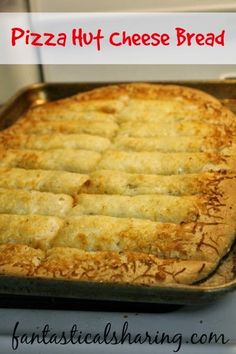 a close up of a pizza in a pan on top of the stove with text overlay