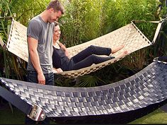 a man and woman are in a hammock