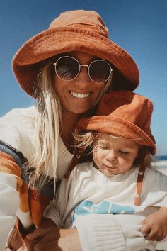 Hello, sun! It's time to embrace the sunny days with Blue Corduroy's Rust Wide Brim Sun Hat. Not only does it add a pop of color to your outfit, it also protects your scalp from the sun's harshness. The wide brim offers a cool, stylish look, and its corduroy texture adds an interesting twist to a typical sun hat. Get ready to be the trendiest at the beach, on a picnic, or just lounging under the trees. Don't let the sun get in the way of your fun, shop now! Newborn Sun Hat, Toddler Bucket Hat, Custom Fitted Hats, Wide Brim Hat Summer, Corduroy Bucket Hat, Toddler Beach, Corduroy Hat, Matching Mom, Baby Sun Hat