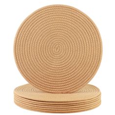 round placemats stacked on top of each other in natural colors, isolated against a white background