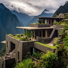 a house on the side of a mountain surrounded by greenery