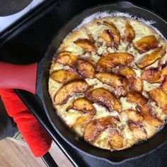 a pan filled with food sitting on top of a stove