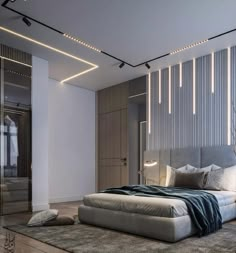 a large bed sitting in the middle of a bedroom next to a tall wall with lights on it