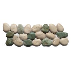 several different colored rocks on a white background