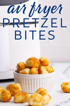 air fryer pretzel bites in a white bowl next to an air fryer