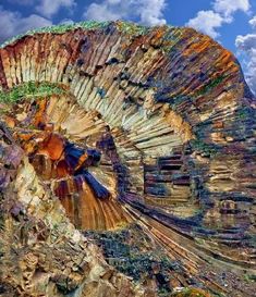 an image of a very colorful rock formation