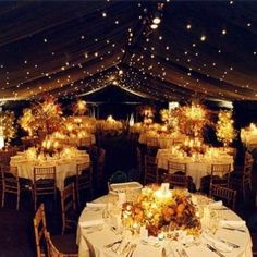 an image of a wedding reception in a marquee with white tablecloths