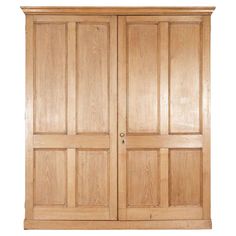 a large wooden armoire with two doors on the front and one door in the back