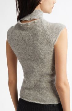 This fitted alpaca-blend sweater, topped off with a mock neck and unexpected cap sleeves, will bring a demure French air to your look. 23" length (size Medium) Mock neck Cap sleeves 75% alpaca, 25% recycled polyamide Dry clean or hand wash, dry flat Made in Spain Paloma Wool Sweater, Paloma Wool, Fabric Gift Bags, Fabric Gifts, Free Fabric, Paloma, Wool Sweaters, Cap Sleeve, Grey Sweater