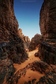 an image of a desert setting with rocks and sand