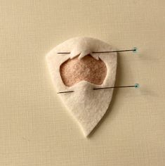 a piece of felt that has been pinned to the wall