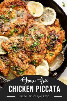 chicken piccata in a skillet with lemons and parsley on the side