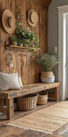 a wooden bench sitting next to a wall with hats on it