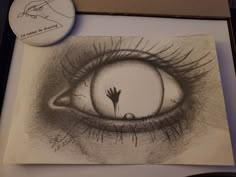 a drawing of an eye with a hand coming out of the iris's eye