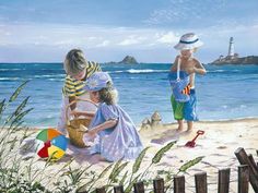 three children playing on the beach with an ocean in the background