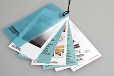 several pieces of paper with tags attached to them