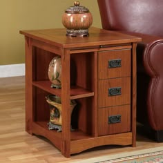 a small wooden table with drawers and a leather chair in front of it for sale