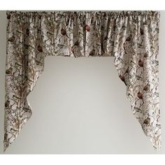 a window curtain with birds on it