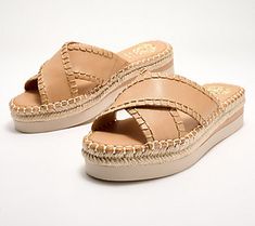 Hello, sunny-season slides! Better get comfy greeting these crossband sandals on the regular. Their leather crisscross bands, jute-wrapped bottom, and espadrille vibe scream summer style. You'll be spotted everywhere in this go-anywhere pair. From Vince Camuto. Summer Vacation Cross Strap Wedge Sandals, Cross Strap Wedge Sandals For Summer Beach, Cross Strap Wedge Sandals For Beach In Summer, Summer Cross Strap Wedge Sandals For Beach, Spring Cross Strap Wedge Sandals With Cushioned Footbed, Spring Wedge Sandals With Cushioned Footbed And Cross Strap, Summer Slide Wedge Sandals For Spring, Leather Cross Sandals For Spring, Leather Crossover Sandals For Spring