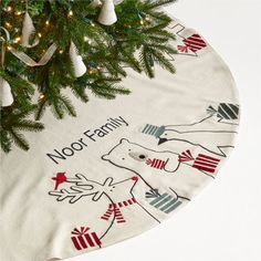 a christmas tree skirt with moose family on it