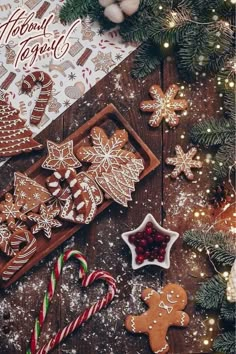 christmas cookies and candy on a wooden table